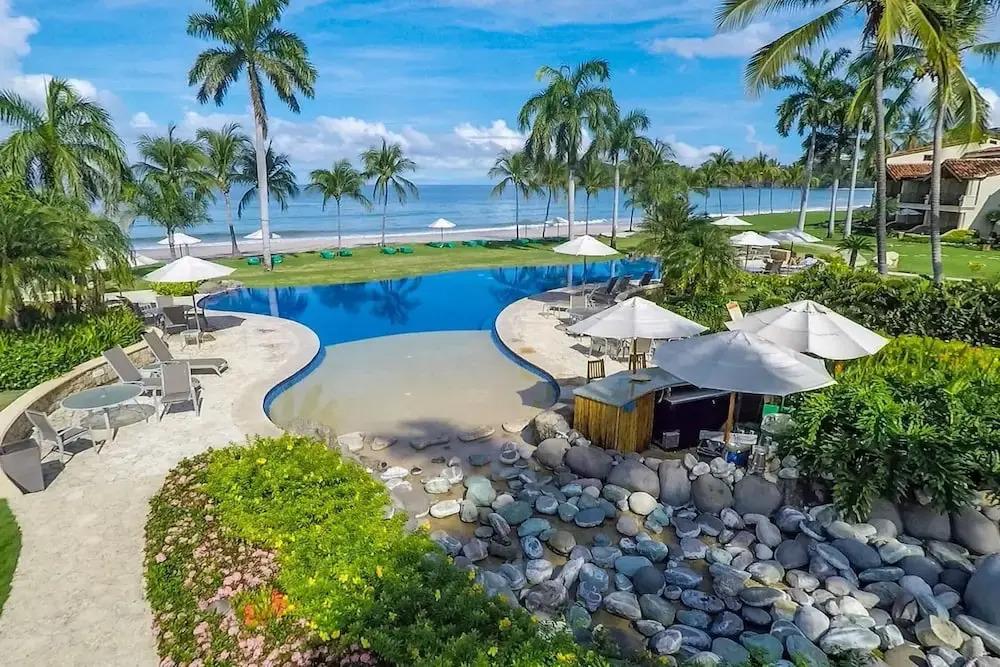 Modern Oceanfront Condo with a Chic Coastal Design, Resort-Style Amenities, and Direct Beach Access
