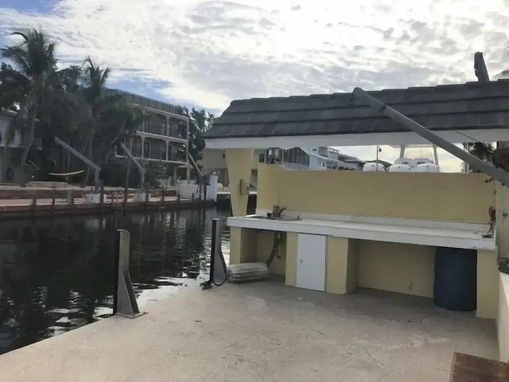 Beautiful Canal Front Home With Above Ground Pool, Dock And Fish Cleaning Station 4 Bedroom Home by RedAwning