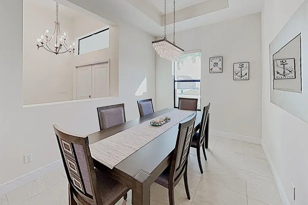 Impeccable Canal-front W/ Lanai & Caged Pool 4 Bedroom Home