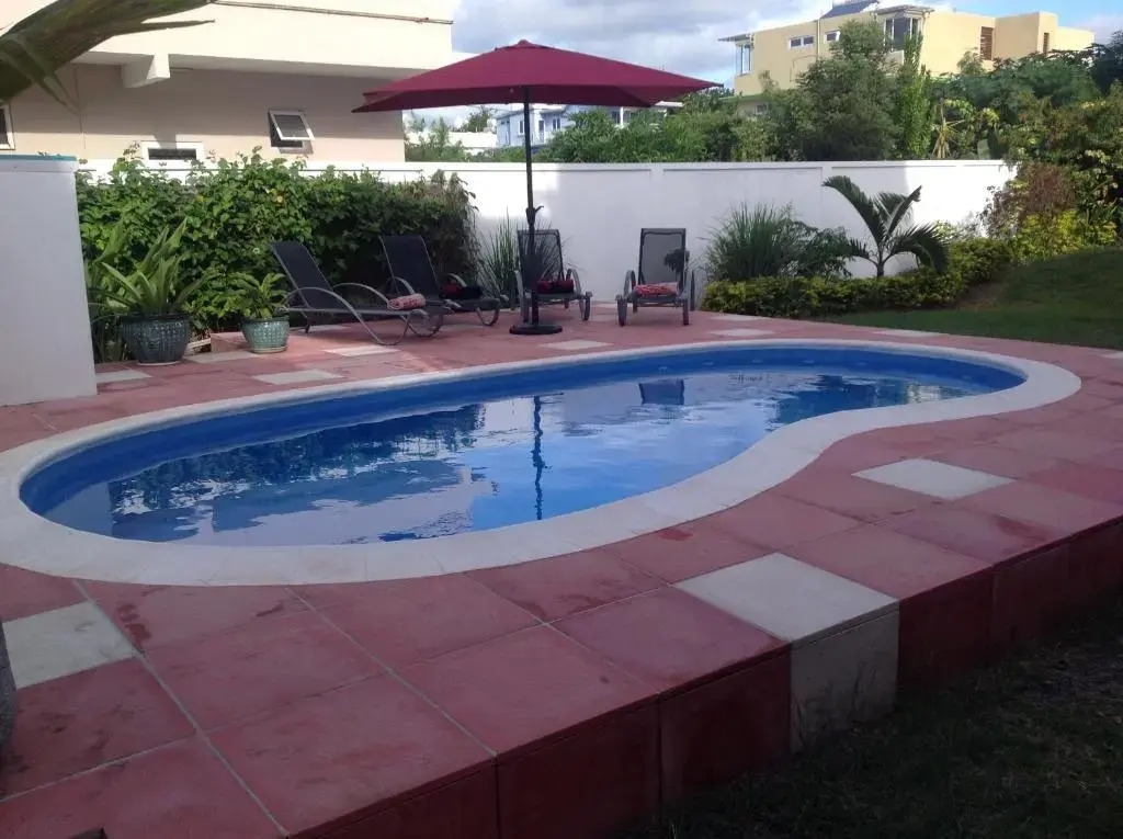 Fayruz Villa is a 3 bedroom, 3 bathroom detached house with AC and swimming pool 5 minutes walk from Flic en Flac public beach