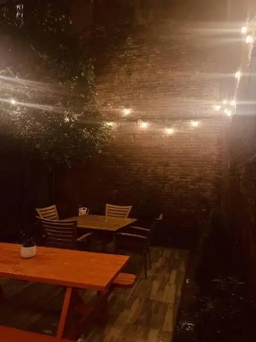 1850s historic Row House 7min train to NYC with private backyard