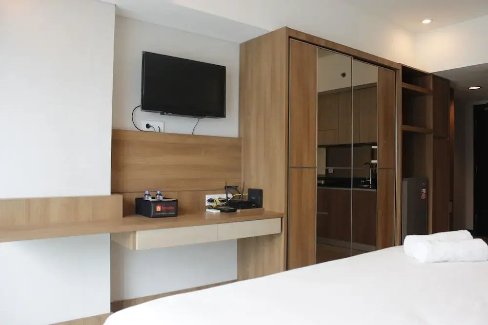 Trendy & Comfy Studio at Tamansari la Grande Apartment