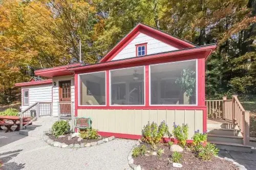 Screened porch pt water views hot tub walk to Saug