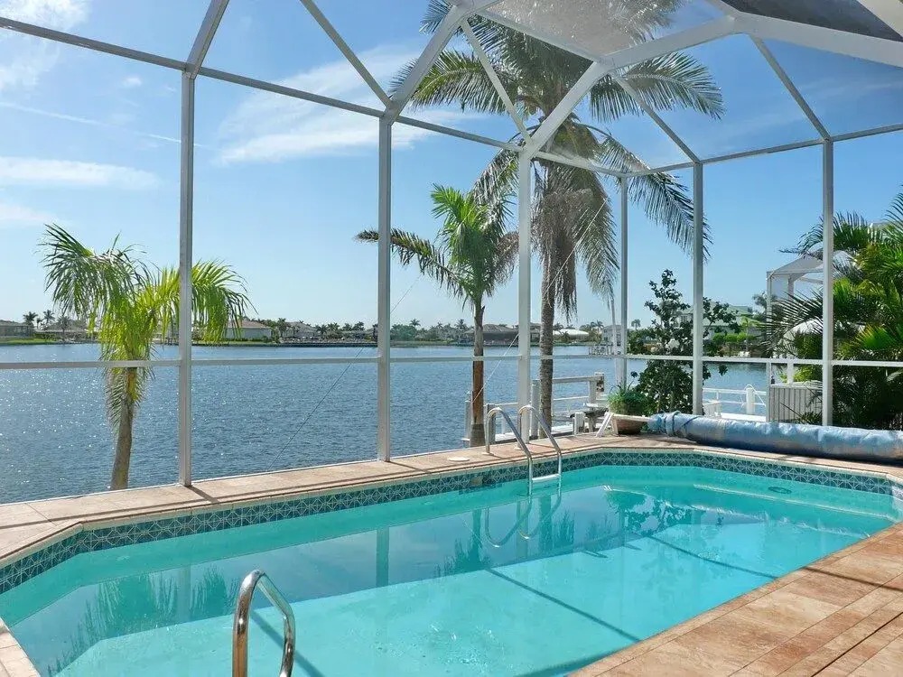 Waterfront home with views, pool and walk to beach