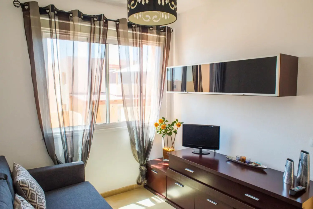 Family Apartment Delfines in Heart of Corralejo- Only 1 min to Sea, with Pool & Free Wifi by Holidays Home