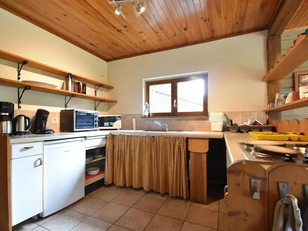 Nestled In A Green Scenery, This Chalet Along The River Is Perfect To Chill Out!