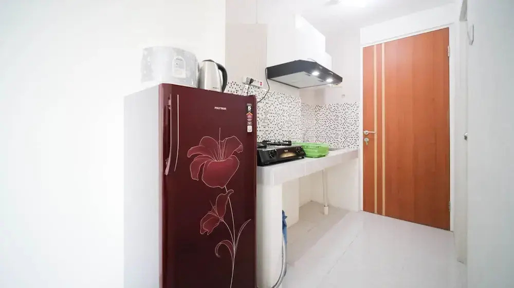 Compact and Tidy Studio at Puncak Dharmahusada Apartment By Travelio