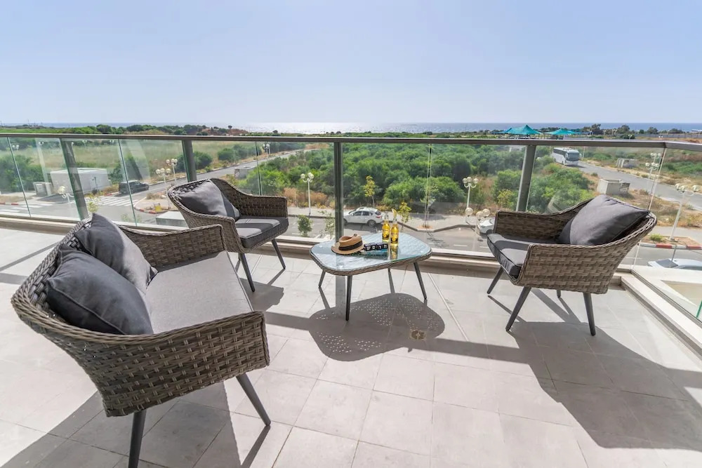 Sunlit Balcony & Coastal Charm by Sea N' Rent