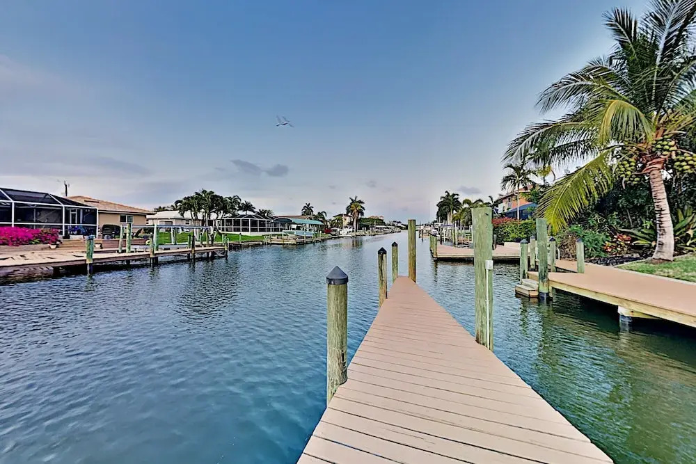 Canal-front W/ Boat Dock & Screened Pool 4 Bedroom Home
