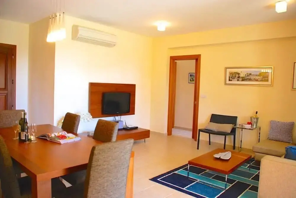Charming 2 bedroom ground floor apartment 'CB01' - with private garden, communal pool and resort facilities, Theseus Village on Aphrodite Hill