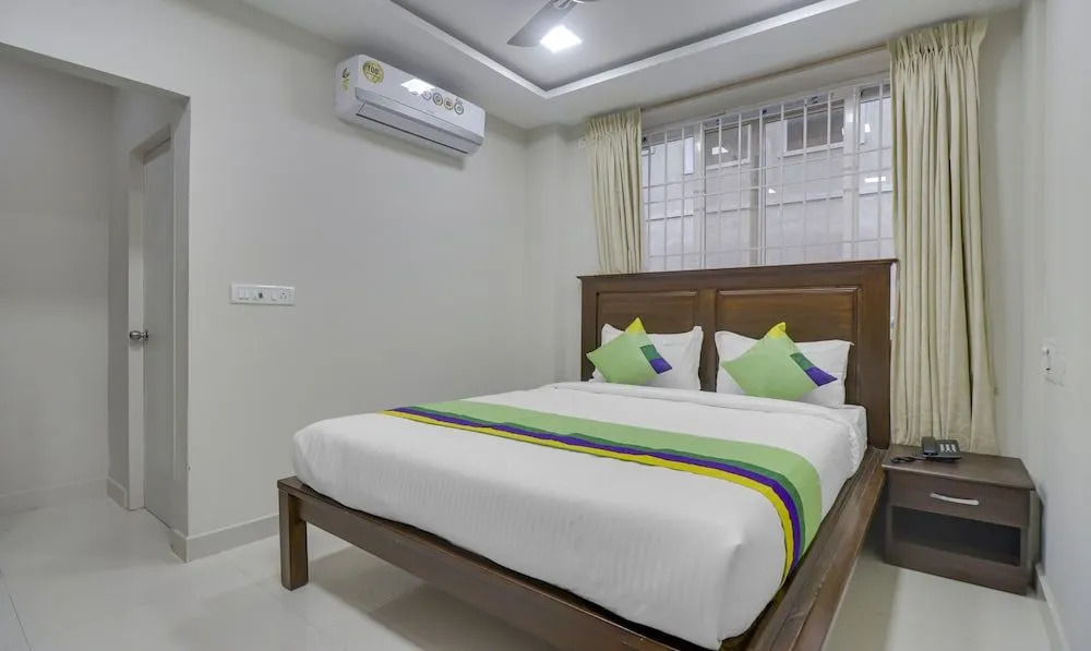 Rithikha Inn crest