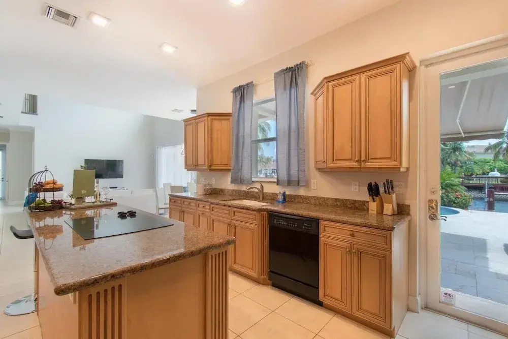 Gorgeous 5 Bedroom Home w/heated Pool Canal Front