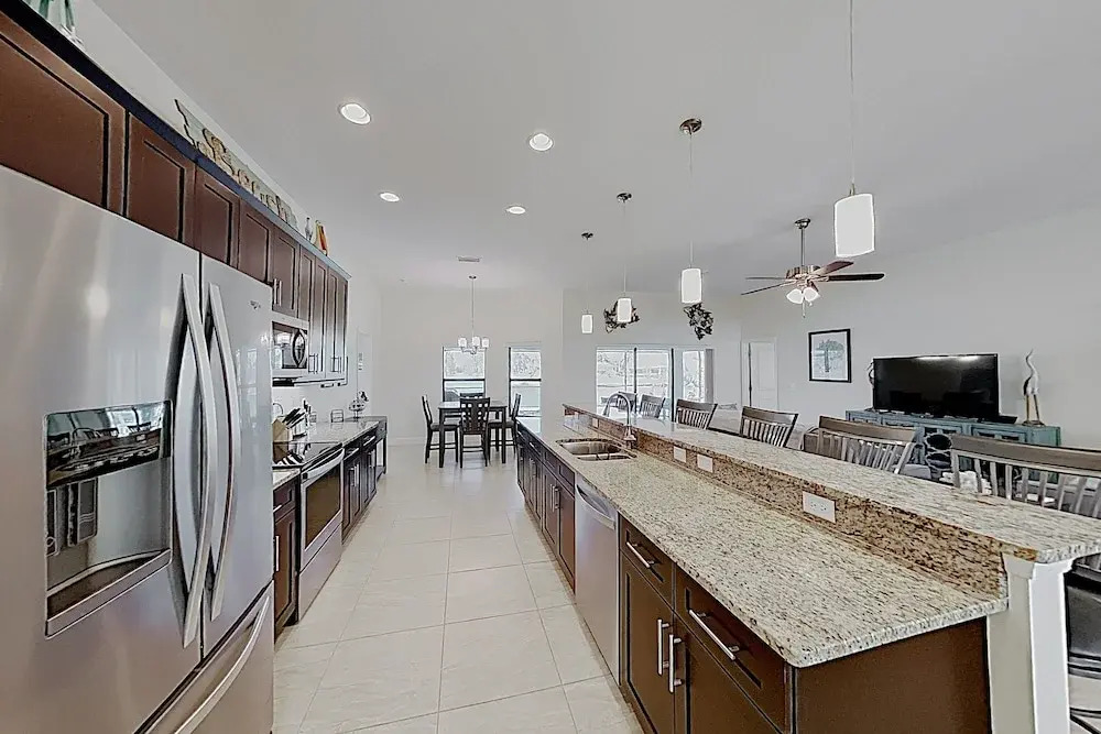 Impeccable Canal-front W/ Lanai & Caged Pool 4 Bedroom Home