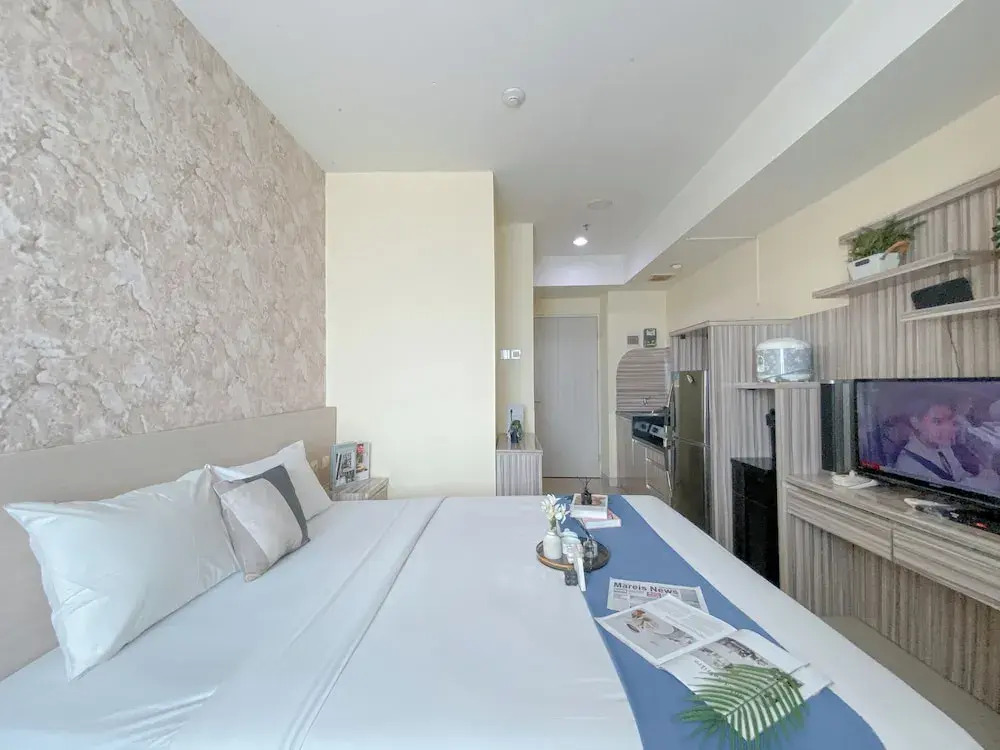 Modern and Homey 1BR without Living Room at Grand Kamala Lagoon Apartment By Travelio