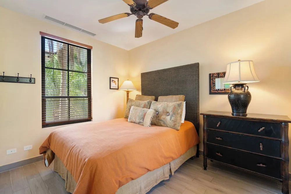 Luxe! Impressively designed 2nd-floor unit in Coco done in red and orange hues