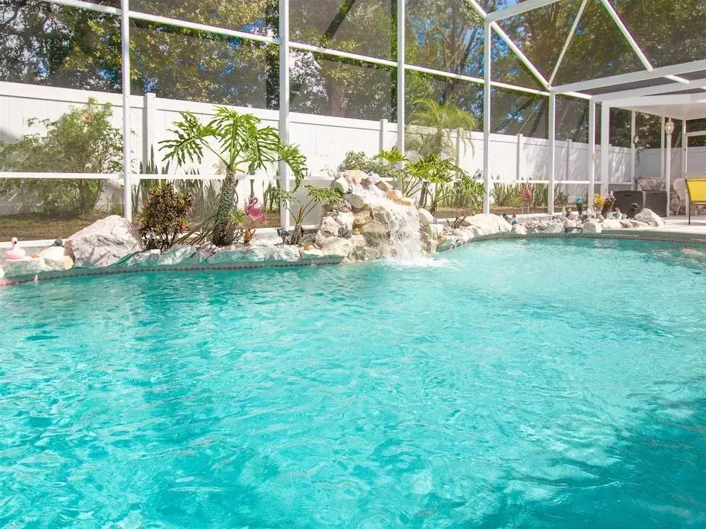 3 Bedroom Home With Private Screened Pool With Rock Waterfall Feature and Gameroom by Florida Dream Homes