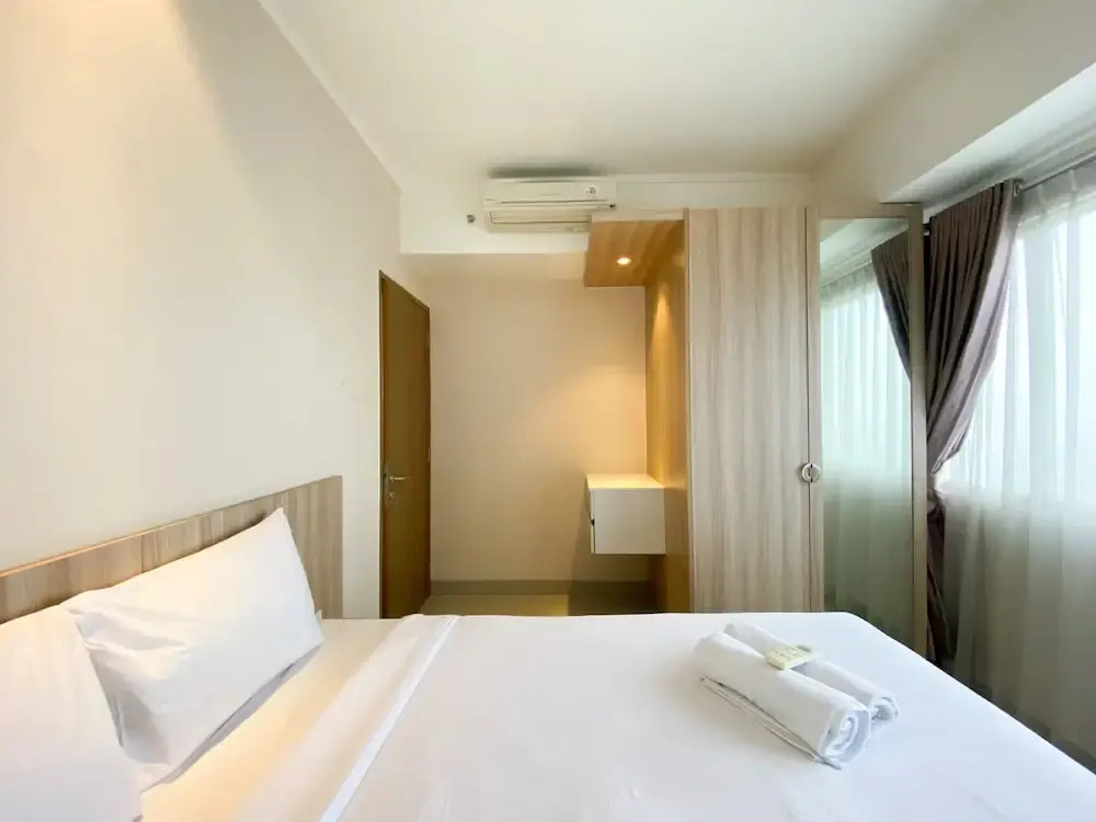Cozy and Minimalist 2BR at 8th Floor The Oasis Cikarang Apartment By Travelio