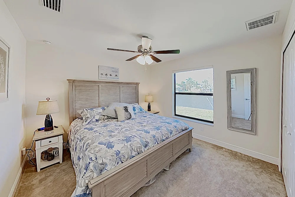 Impeccable Canal-front W/ Lanai & Caged Pool 4 Bedroom Home