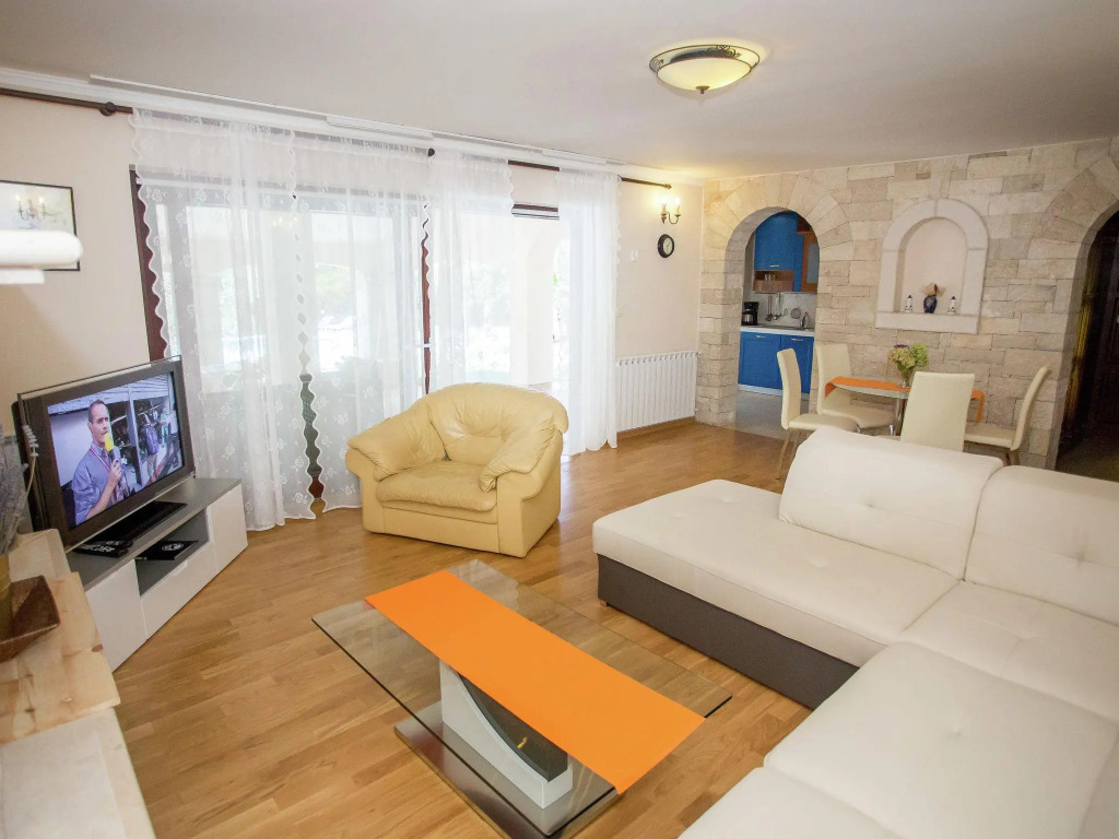 Nicely furnished apartment with covered terrace, located in front of the pool