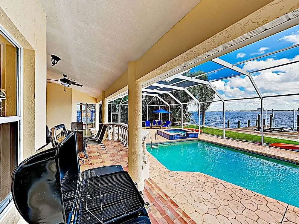 Riverfront Paradise W/ Caged Pool, Hot Tub & Dock 3 Bedroom Home