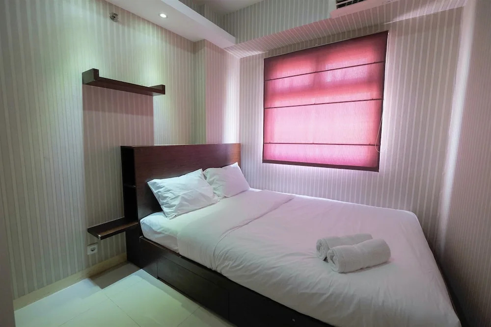 Homey and Relaxing 2BR Green Pramuka Apartment