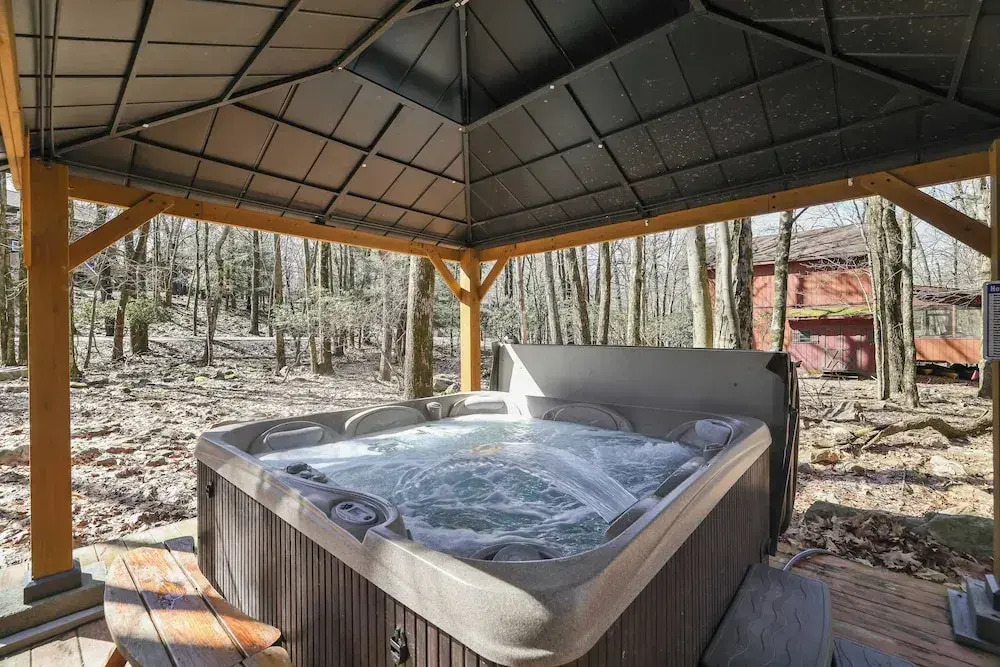Hot Tub + Sauna + Deck + Firepit + Beach Access + Near Dining Grateful Escape by Avantstay