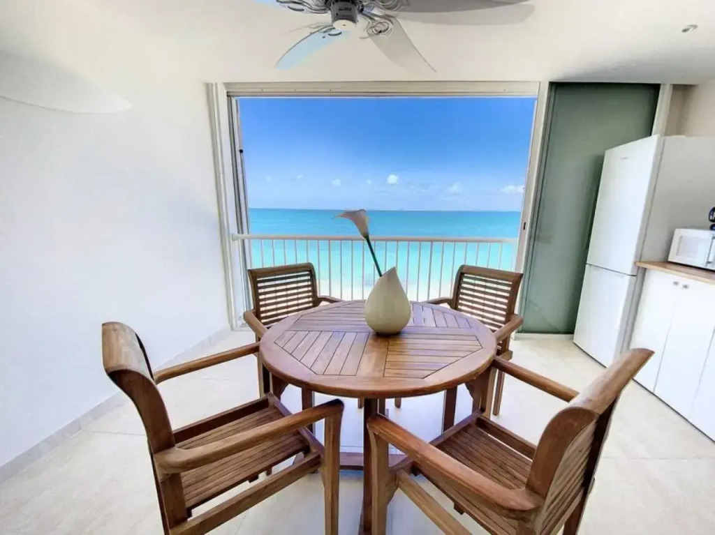Pavillon Beach 9, feet in the water in Grand Case