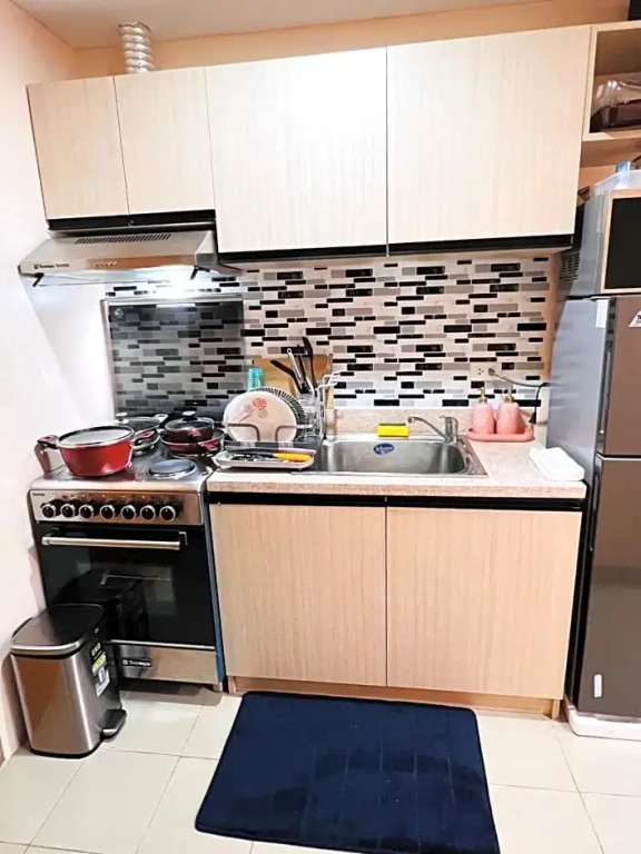 New Cozy 2 bedroom unit condotel for staycation with living room and kitchen set with pool