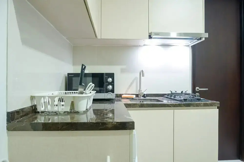 Strategic Location 1BR Apartment @ Puri Mansion near Puri By Travelio