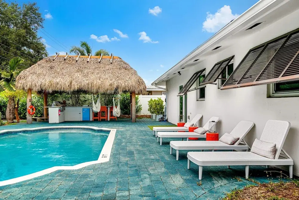 Eccentric Home With Pool Tiki hut Outdoor Kitchen