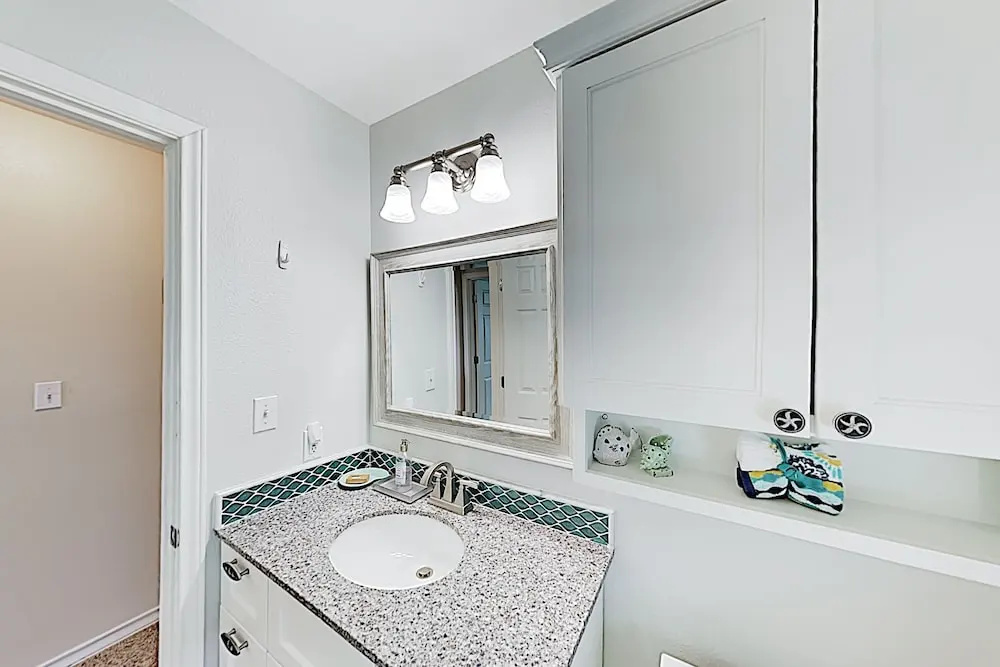 Canal-front Getaway W/ Enclosed Deck & Boat Dock 4 Bedroom Home