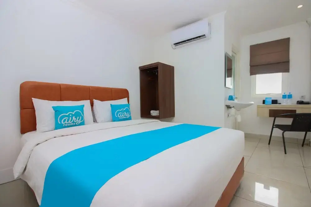Airy Mapanget AA Maramis Manado