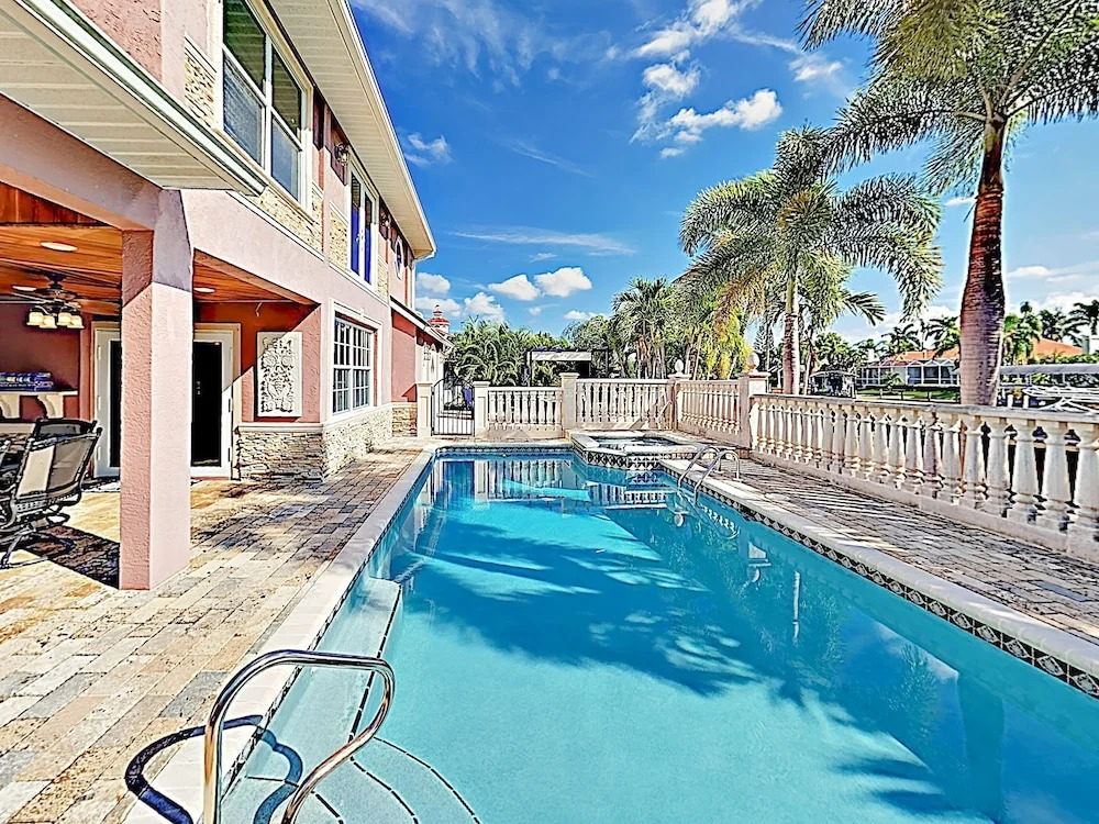 New Listing! European-style On Canal W/ Pool 4 Bedroom Home