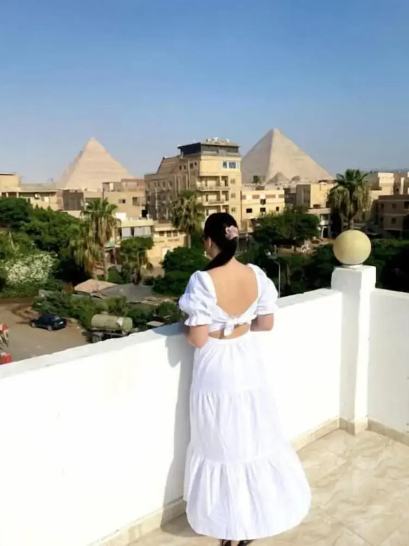 Nefertiti Pyramids View
