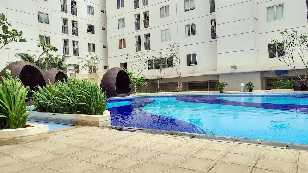 Minimalist 1BR with Pool View at Bassura City Apartment