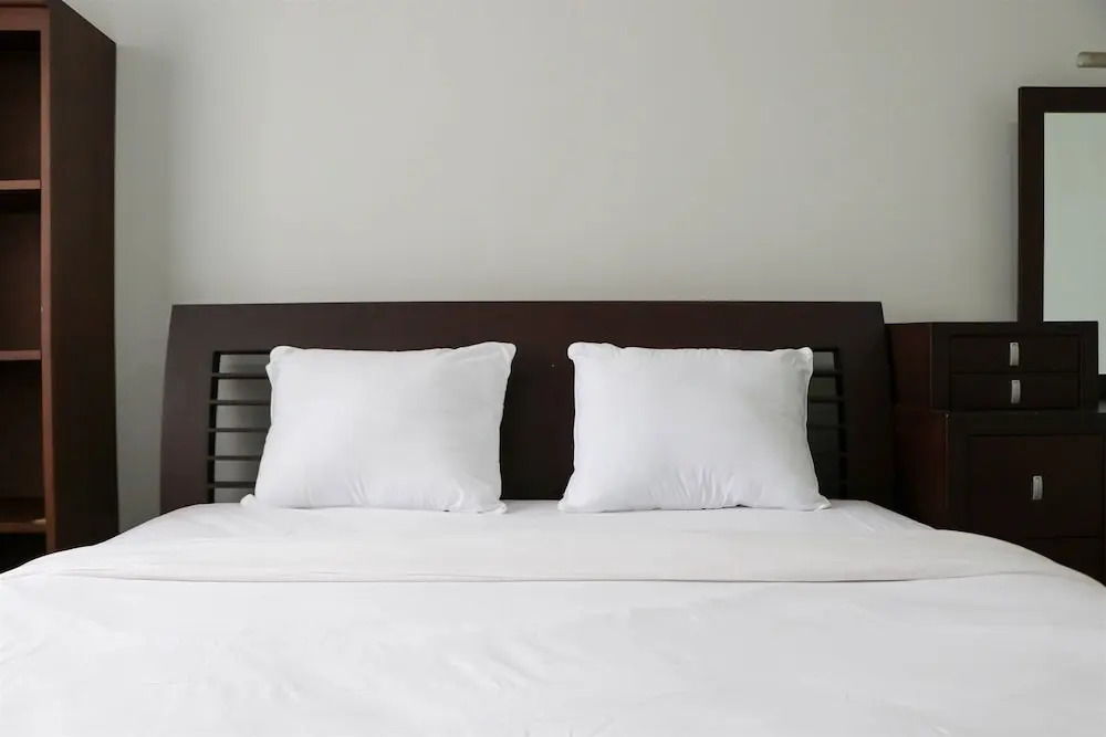 Cozy Living and Modern 2BR Puri Garden Apartment By Travelio