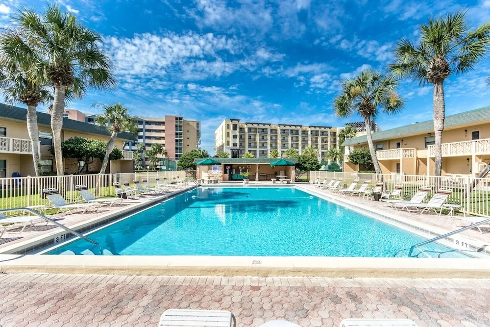 Ground Floor Pool Front Condo Sleeps 8 with easy beach access by RedAwning