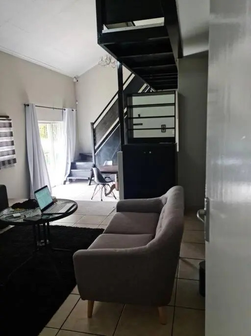 Justin's Place Lounge. An Exceptional Home with no Load Shedding, by The Grove Mall and Wilgers Hospital.
