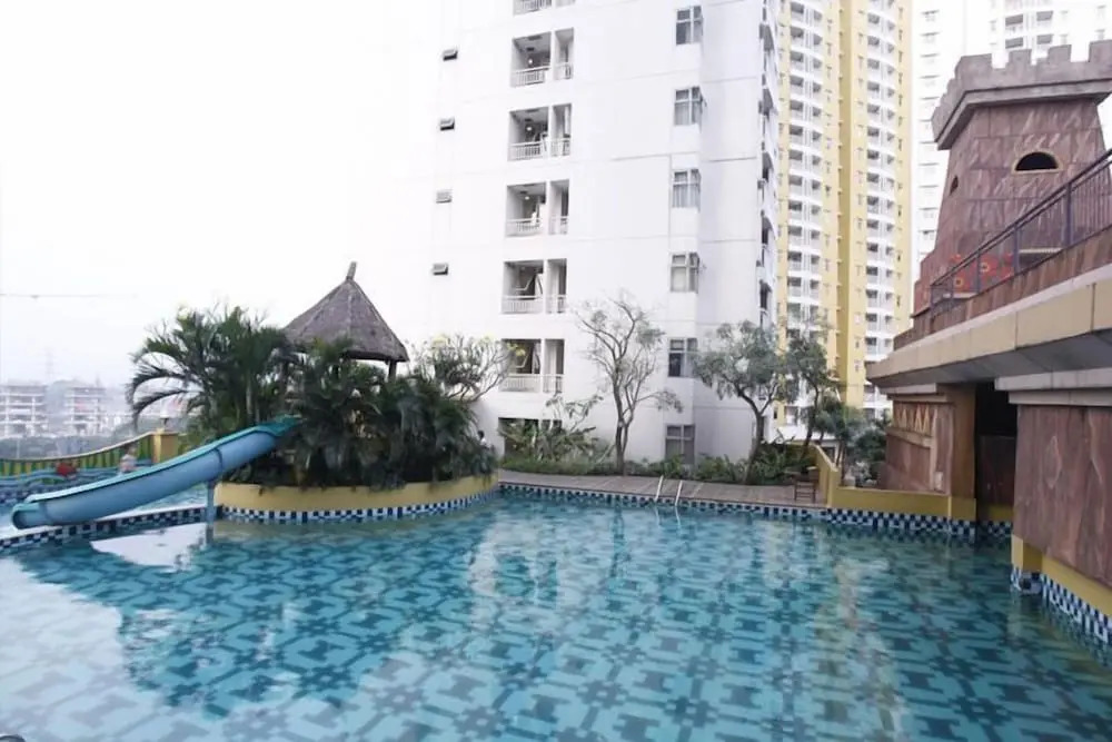 Modern Studio Grand Serpong Apartment By Travelio