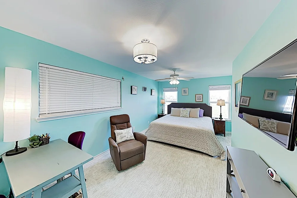 Canal-front Getaway W/ Enclosed Deck & Boat Dock 4 Bedroom Home