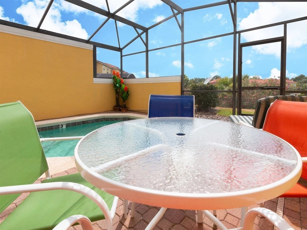 Private Screened Splash Pool Overlooking Tranquil Lake Right Beside Disney World by Florida Dream Homes