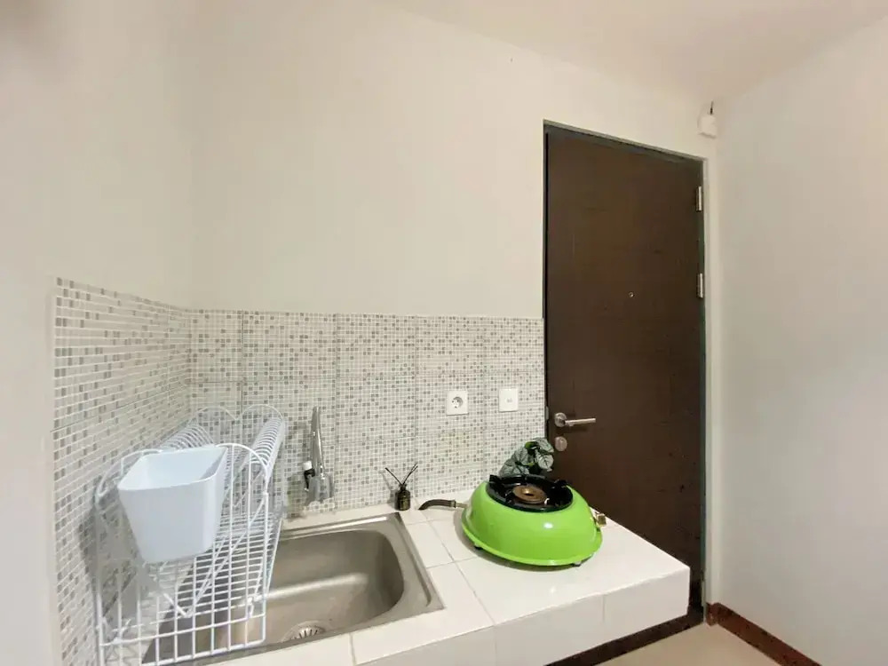 Minimalist And Cozy 1BR at Royal Heights Apartment