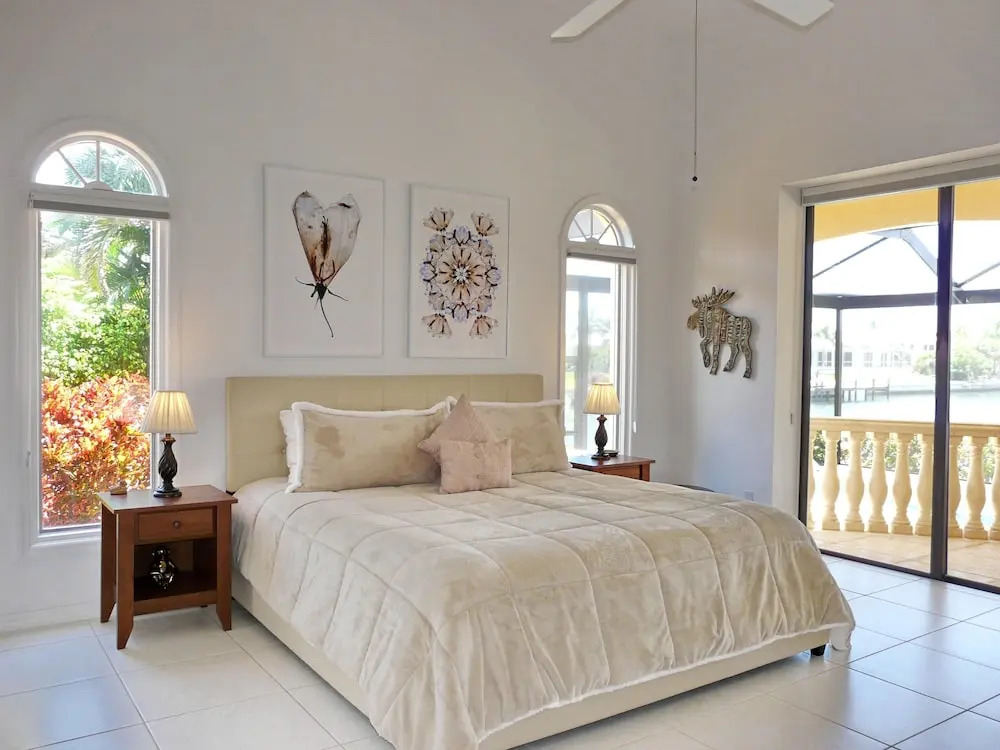 Serene waterfront home with pool, spa, and water view