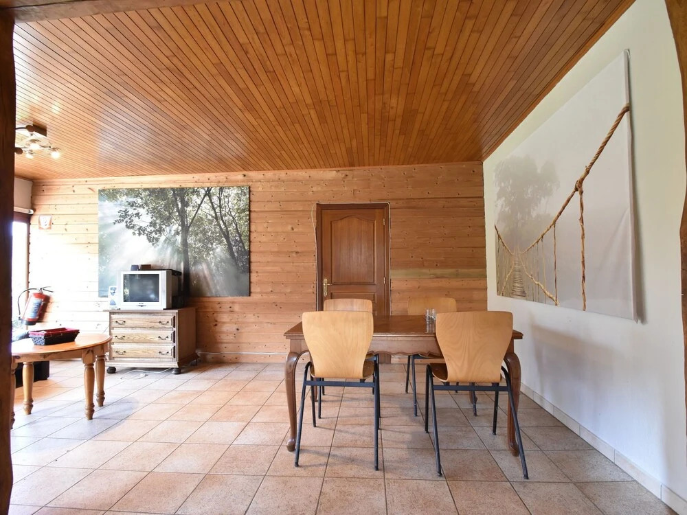 Nestled In A Green Scenery, This Chalet Along The River Is Perfect To Chill Out!