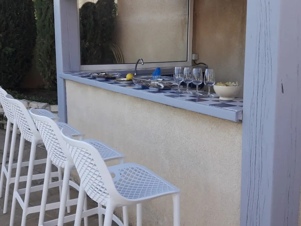 Holiday villa near Narbonne-Plage, fenced private swimming pool and view of a lake