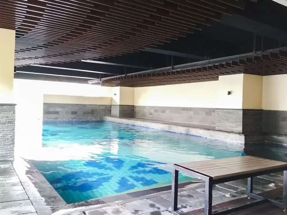 Trendy & Comfy Studio at Tamansari la Grande Apartment