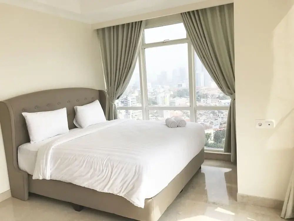 Luminous 2 Bedrooms at Menteng Park Apartment by Travelio