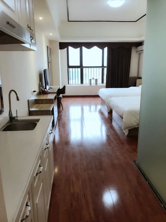 Xingyue Apartment Luogang Wanda