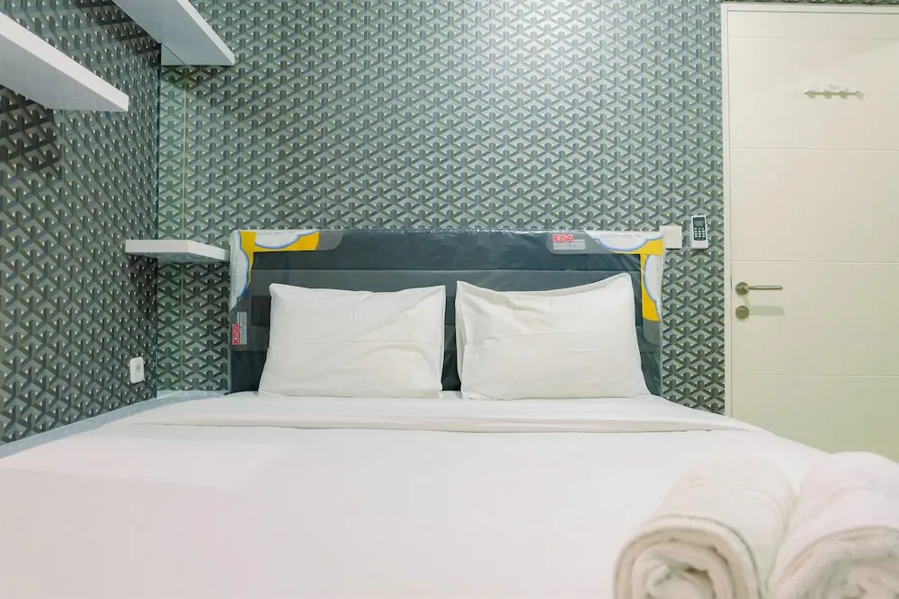 Homey 2BR with Pool View Apartment @ Springlake Summarecon By Travelio