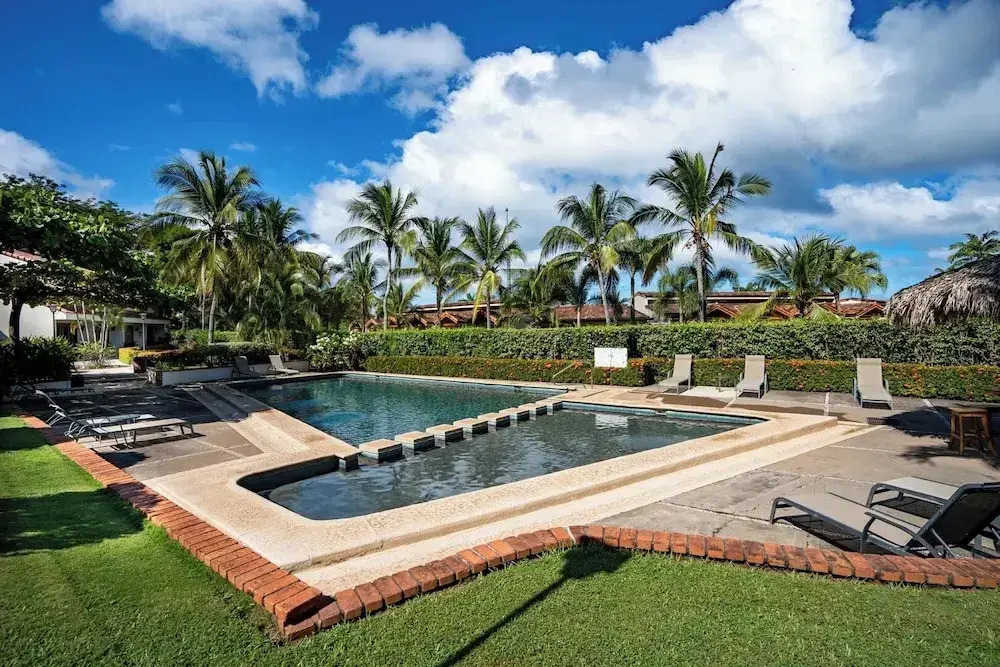 Stylish 2-Bedroom Beach Condo with Ocean-View Deck, Lush Pool Area & 2-Minute Walk to Flamingo Beach